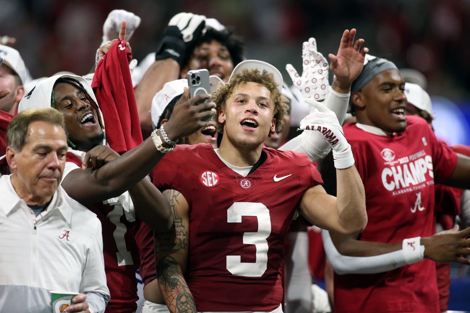 Dec 2, 2023; Atlanta, GA, USA; Alabama Crimson Tide wide receiver Jermaine Burton (3) celebrates with teammates on the podium after defeating the Georgia Bulldogs in the SEC championship game at Mercedes-Benz Stadium.